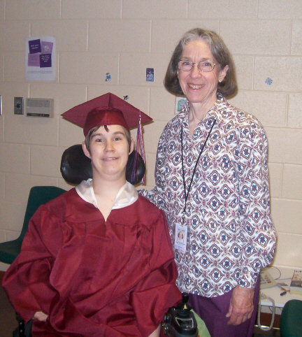 Brantley in Cap and Gown with Ms. Judy