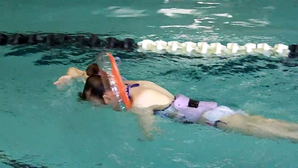 Brantley swimming under water with WaterWay Babies Neck Float 5-27-1402